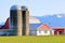 Two Grain Elevators on Rural Farm