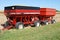 Two grain wagons filled with a harvest.