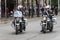 Two Greek police officers on motorcycle at 28th Oktovriou st closing the road.