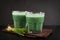 Two green barley grass shots