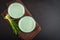 Two green barley grass shots