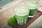 Two green barley grass shots