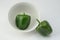 Two green bell peppers