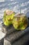 Two Green Coconuts on Rustic Wood Table