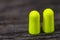 Two green colorful safety earplugs close up macro shot