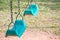 Two green swing for kids playing