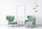 Two green velvet chairs in modern interior space. White  wall background with wooden frame
