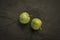 Two greengages on slate