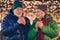 Two grey white hair old people parents married couple enjoy x-mas christmas spirit walk date under evening illumination