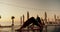 Two guys doing wellness yoga on the beach at sunrise. Sports and morning exercises