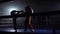 Two guys preparing for kickboxing competitions. Slow motion. Silhouette
