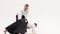 Two guys showing aikido using tanto. Isolated, white. Close up. Close up. Slow motion.