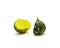 Two half cuts of baby winter squash, round eight ball gourd faint vertical ridges, speckled green striping, yellow mottling