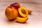 Two and half nectarine on wooden background