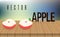 Two halfs of red apple on the wooden table, blur background