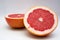 Two halfs red grape fruit