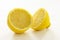 Two halves of a fresh organic lemon on white background - close up Image