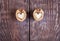 Two halves of walnut in shape of heart are lying on two part of