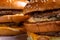 Two Hamburgers, details of two gourmet double burgers, on wooden background, selective focus