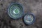 Two hand painted blue ceramic dishes, traditional Uzbek utensils dishes, bowl, plates with national floral ornament on dark