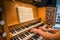 Two hand playing a church organ in Kristkirken