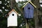 Two Handmade Birdhouses One White One Blue Outdoors