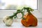 Two handmade pumpkins from felted wool for celebration of Halloween on the windowsill