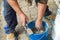 Two hands with bricklayer trowel