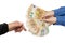 Two hands of business women make transactions. Woman giving a bunch of euro banknotes to another person on a white background .Con