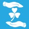 two hands with Clover with three leaves sign icon. on a blue background. Saint Patrick symbol