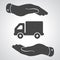 Two hands with flat truck pictogram