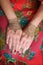 Two hands with henna tattoos mehendi designs