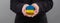 Two hands holding house with Ukrainian flag color. Stop war, support and save Ukraine concept