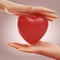 Two hands holding and protecting red heart over pink background. Concept of love, valentine and support. 3D rendering.