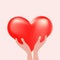 Two hands holding a red 3-d heart.The concept of love, support, congratulations.