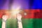Two hands shackled a metal chain on the background of the Azerbaijan flag. Freedom concept