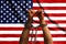 Two hands shackled a metal chain on the background of the USA flag