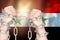 Two hands shackled a metal chain on the Syria flag. Freedom concept