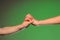 Two hands stretch to each other from the opposite sides symbolizing the close connection between