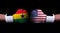 Two hands of wearing boxing gloves with USA and Ghana flag. Boxing competition concept. Confrontation between two countries