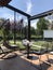 Two hanging chairs in garden on sunny summer day