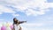 Two happy Asain girl holding balloon with blue sky background