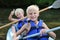 Two happy boys kayaking on the river