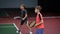 Two happy boys serving and returning balls on court with racket. Children hitting forehand in tennis having lesson