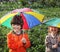 Two happy brother with umbrella