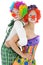 Two happy clowns made up in costume for carnival scream and shout