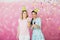 Two happy girls celebrate birthday party with cupcake confetti a