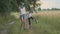 Two happy girls sisters walking after rain in dirty clothes children talking laughing, fun pouring water from their boots