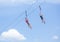 Two happy kids playing on a zip line view from below
