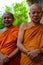 Two happy laughing Buddhist monks in robes Hat Yai Thailand